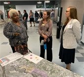 Commissioner Garris, Chief Resiliency Officer Jessica Beach and a resident 